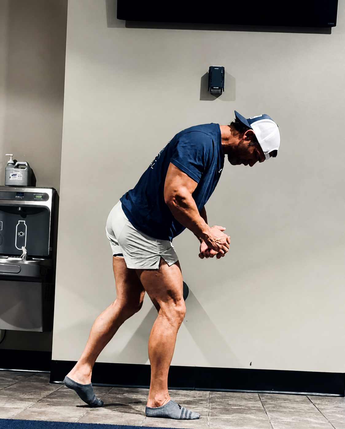 Trey demonstrating a full-body strength and mobility movement