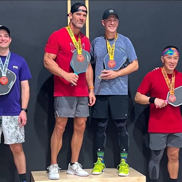 Trey and fellow players on a pickleball tournament podium